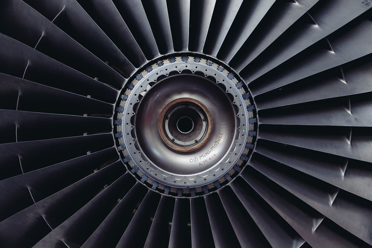 Aircraft maintenance technician referencing ATA iSpec 2200 technical documentation during a fleet inspection