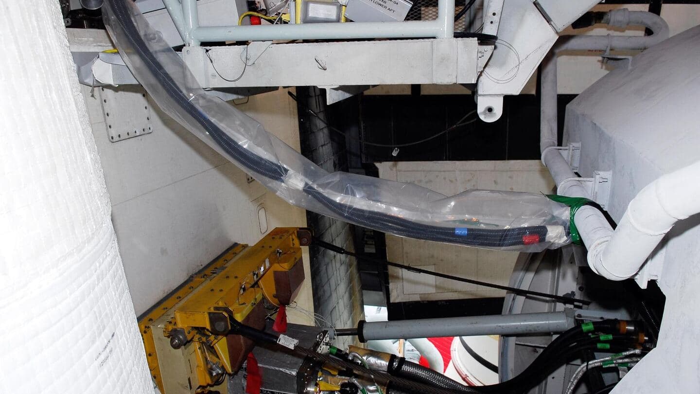White ducting and hardware assemblies inside a test facility