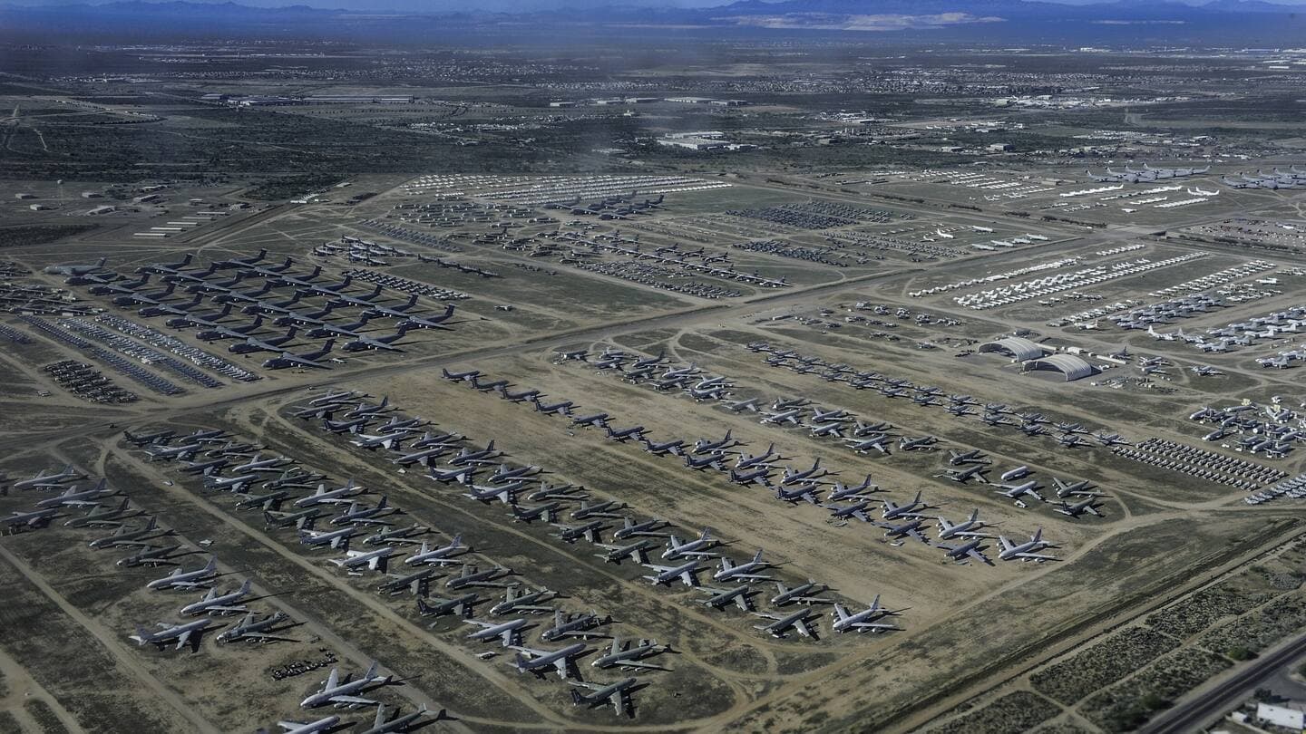 Aerial view of thousands of retired military aircraft in rows at the Davis-Monthan boneyard