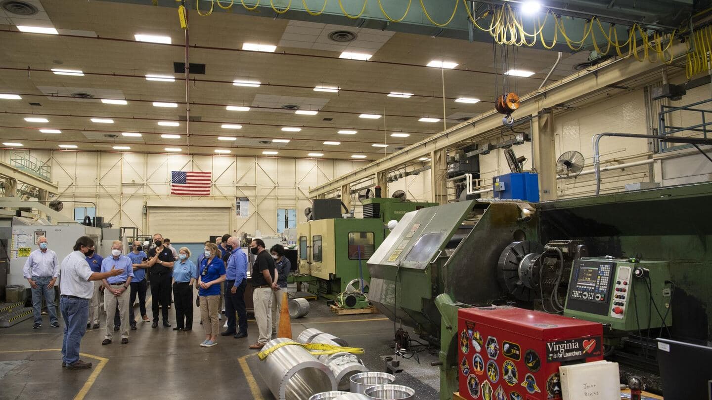 A machine shop floor with lathes and mills in rows