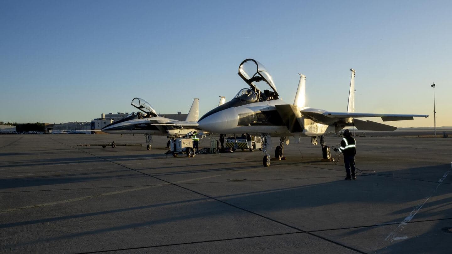 Two research jets parked on a ramp at dawn