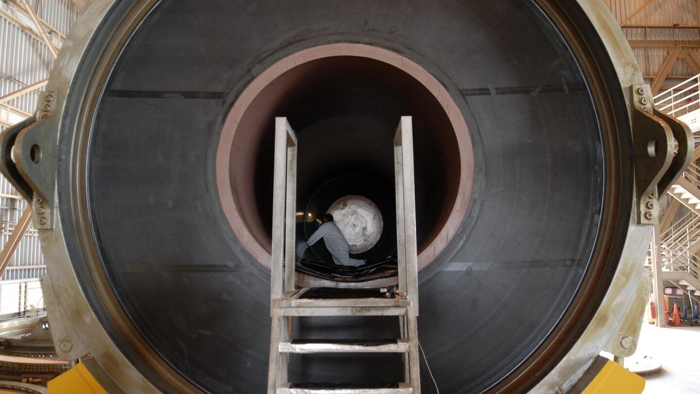 Looking into a large test cylinder with a ladder leading inside