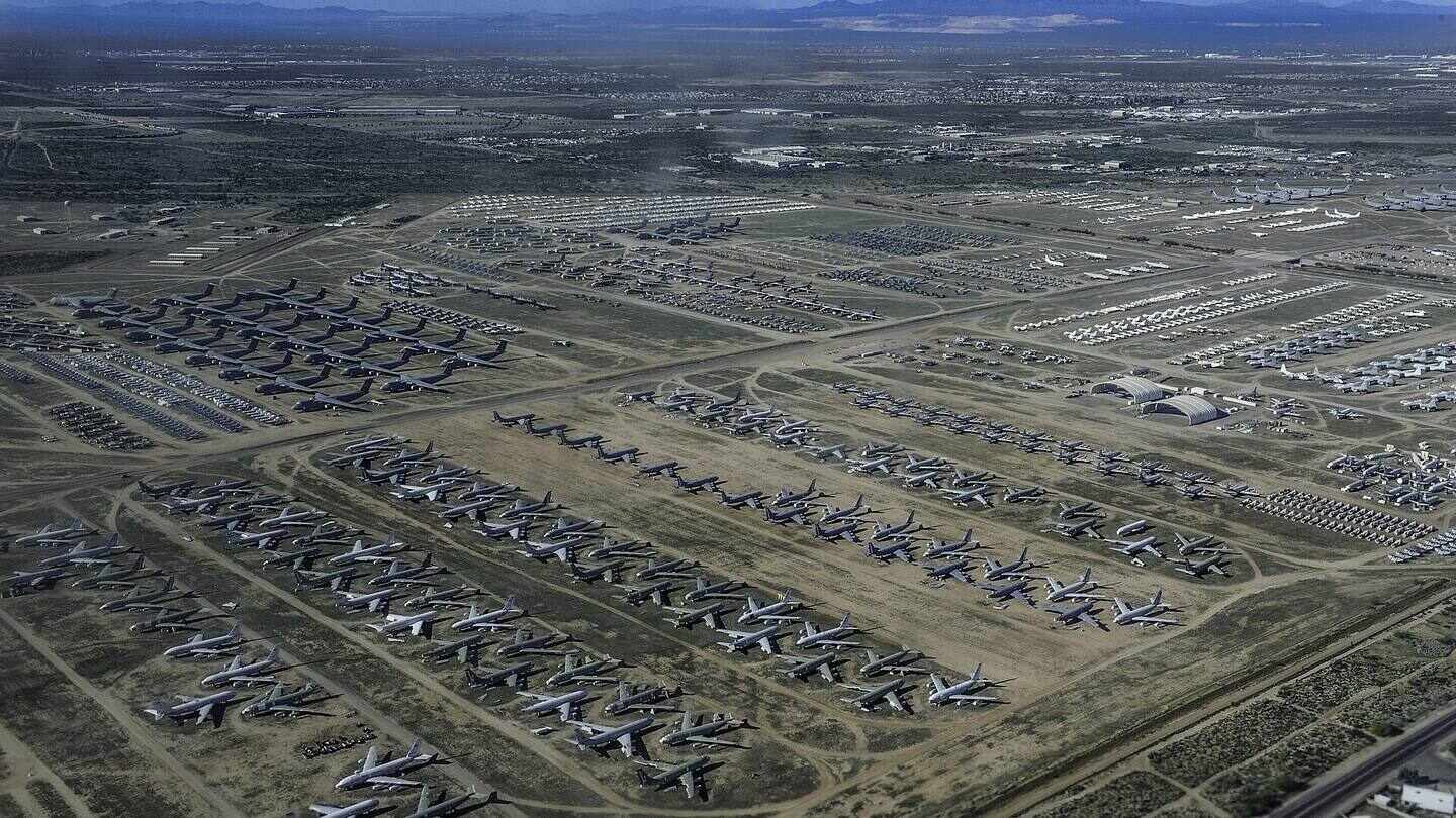 Aerial view of rows of stored aircraft at a desert storage base